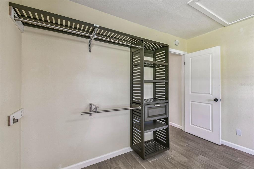 5319 Saddlebrook Way Wesley Chapel, FL 33543 - Photo 51 of 77 a view of walk in closet with empty racks