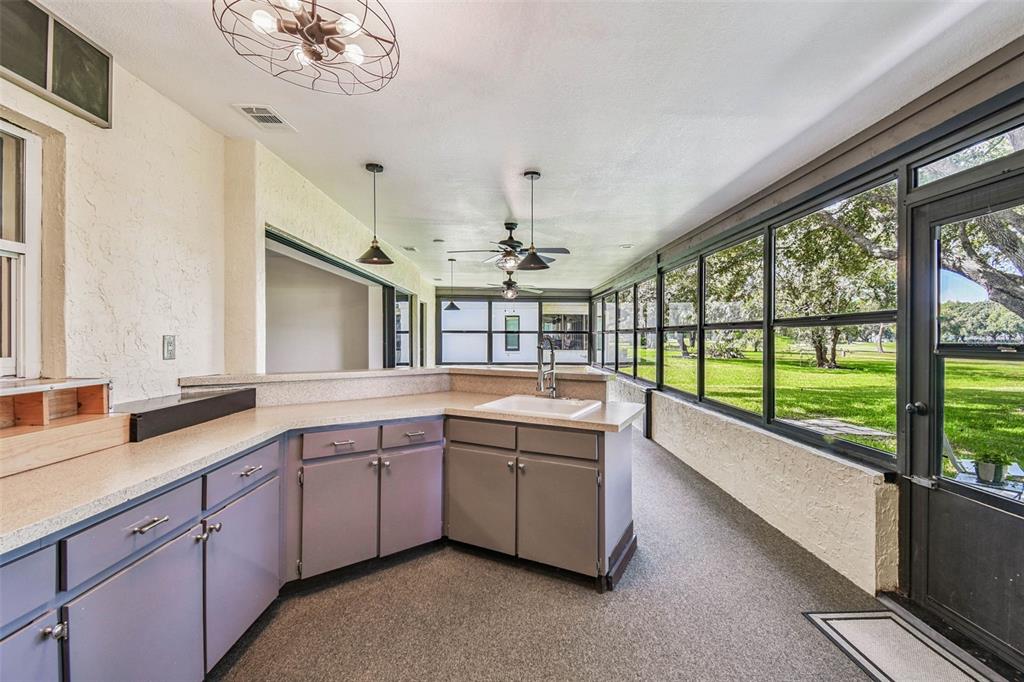 5319 Saddlebrook Way Wesley Chapel, FL 33543 - Photo 54 of 77 a large white kitchen with a large window