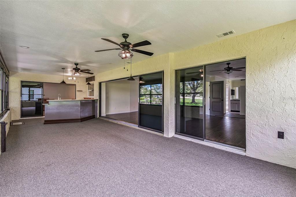 5319 Saddlebrook Way Wesley Chapel, FL 33543 - Photo 60 of 77 a living room with furniture and a ceiling fan
