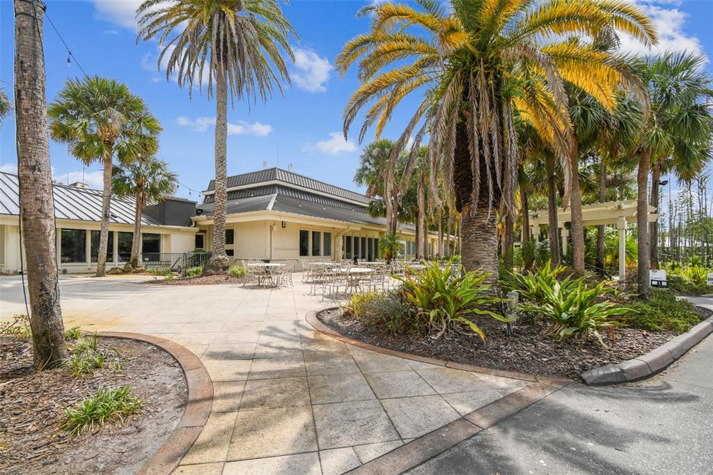 5319 Saddlebrook Way Wesley Chapel, FL 33543 - Photo 74 of 77 a front view of a house with garden and swimming pool