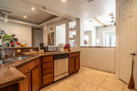 a kitchen with stainless steel appliances granite countertop a sink and cabinets