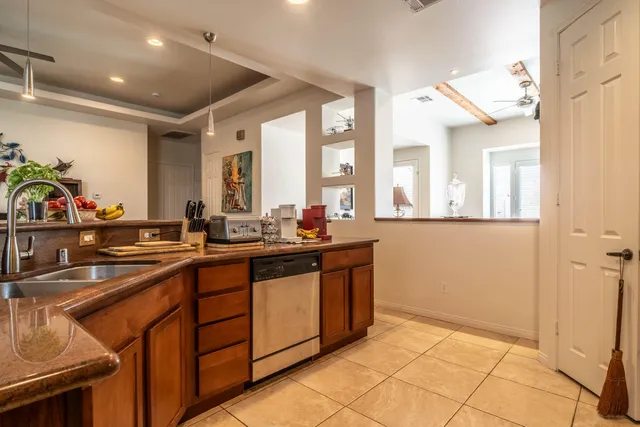 a kitchen with stainless steel appliances granite countertop a sink and cabinets
