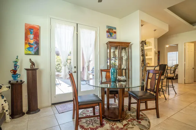 a view of a livingroom with furniture and a window