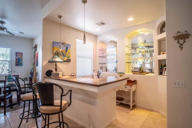 a kitchen with a sink cabinets and window
