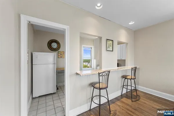 a view of a livingroom with furniture and a window