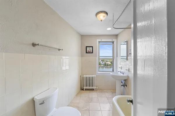 a bathroom with a toilet sink and shower