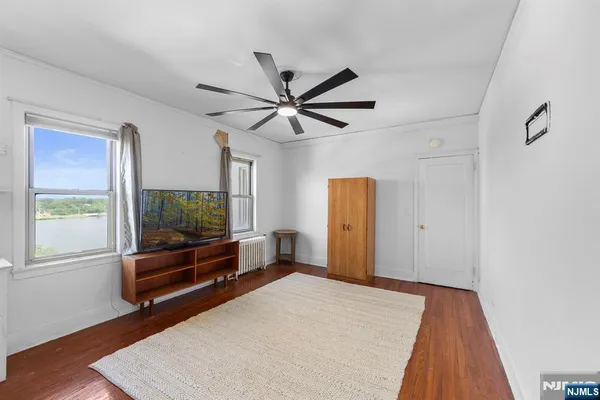 a bedroom with furniture and window