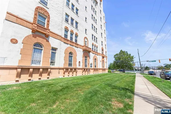a view of a building with a yard