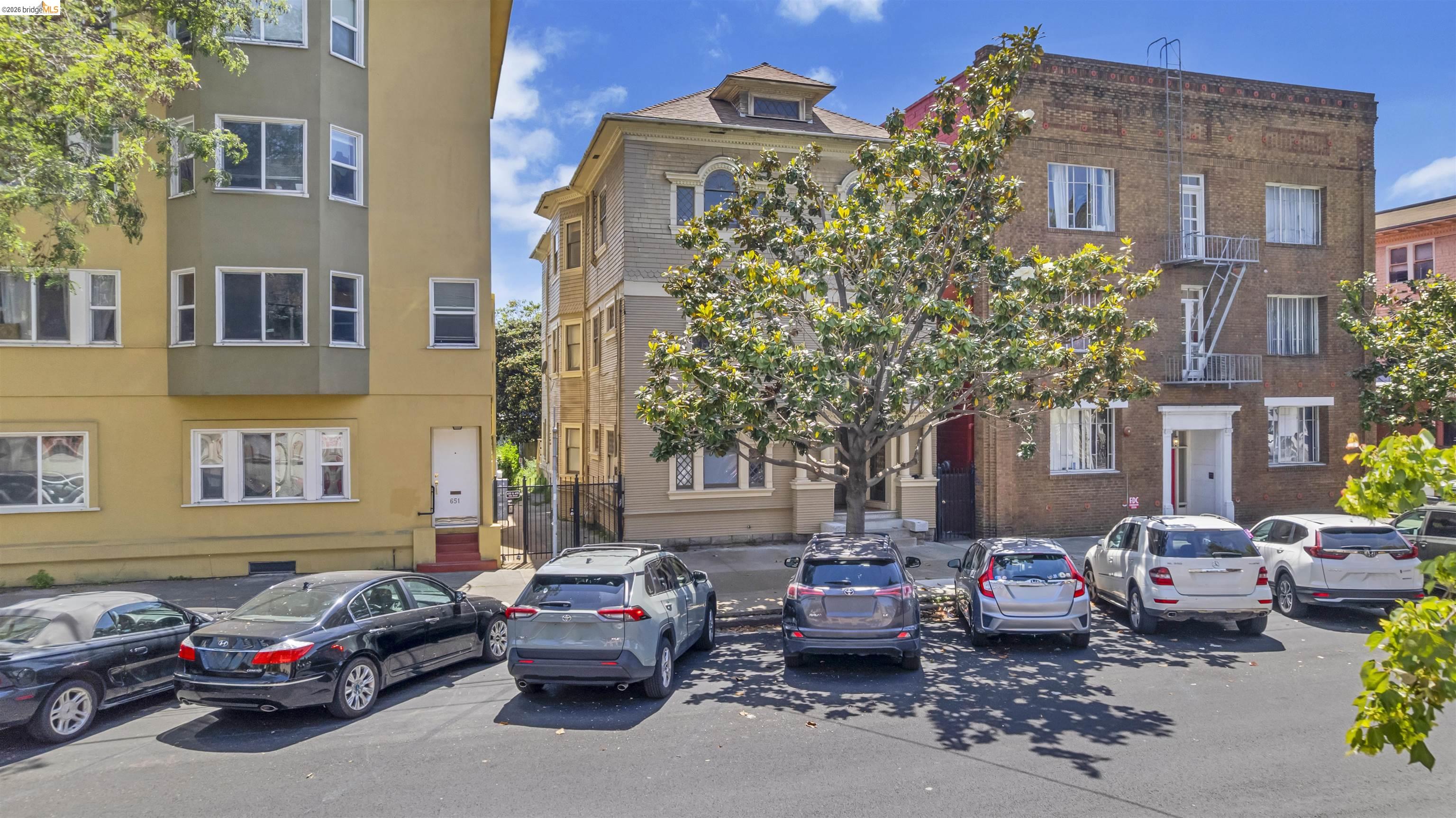 667 10th Street Oakland, CA 94607 - Photo 15 of 15 a car parked in front of a brick building