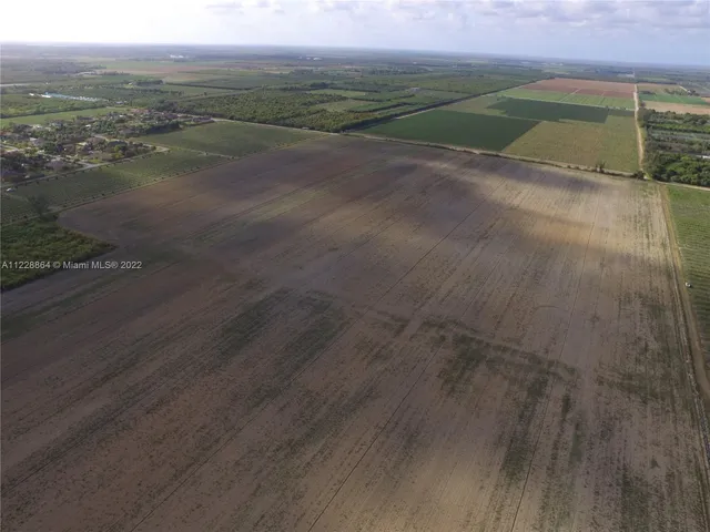 an aerial view of a houses with outdoor space