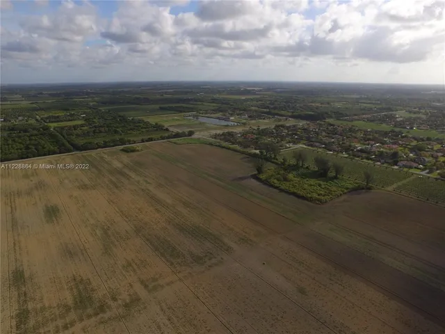 an aerial view of residential building and ocean