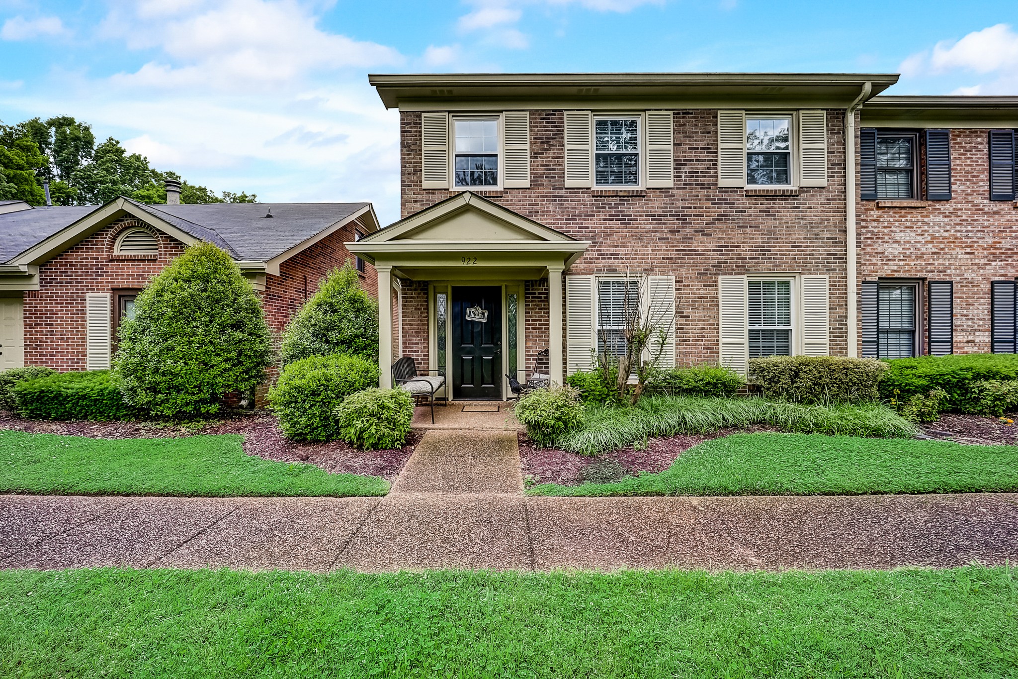922 General George Patton Road Nashville, TN 37221 - Photo 1 of 30 a front view of a house with a garden