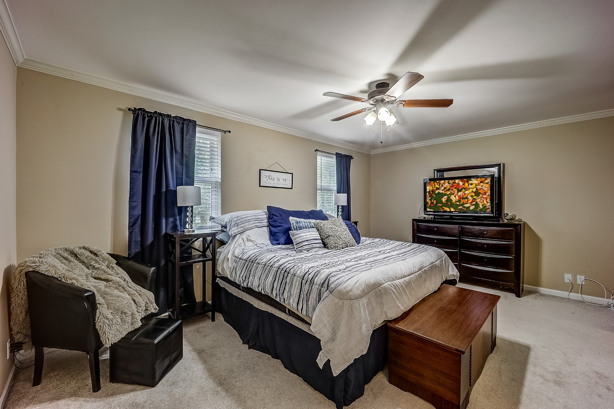 922 General George Patton Road Nashville, TN 37221 - Photo 17 of 30 a bedroom with a bed and a chandelier