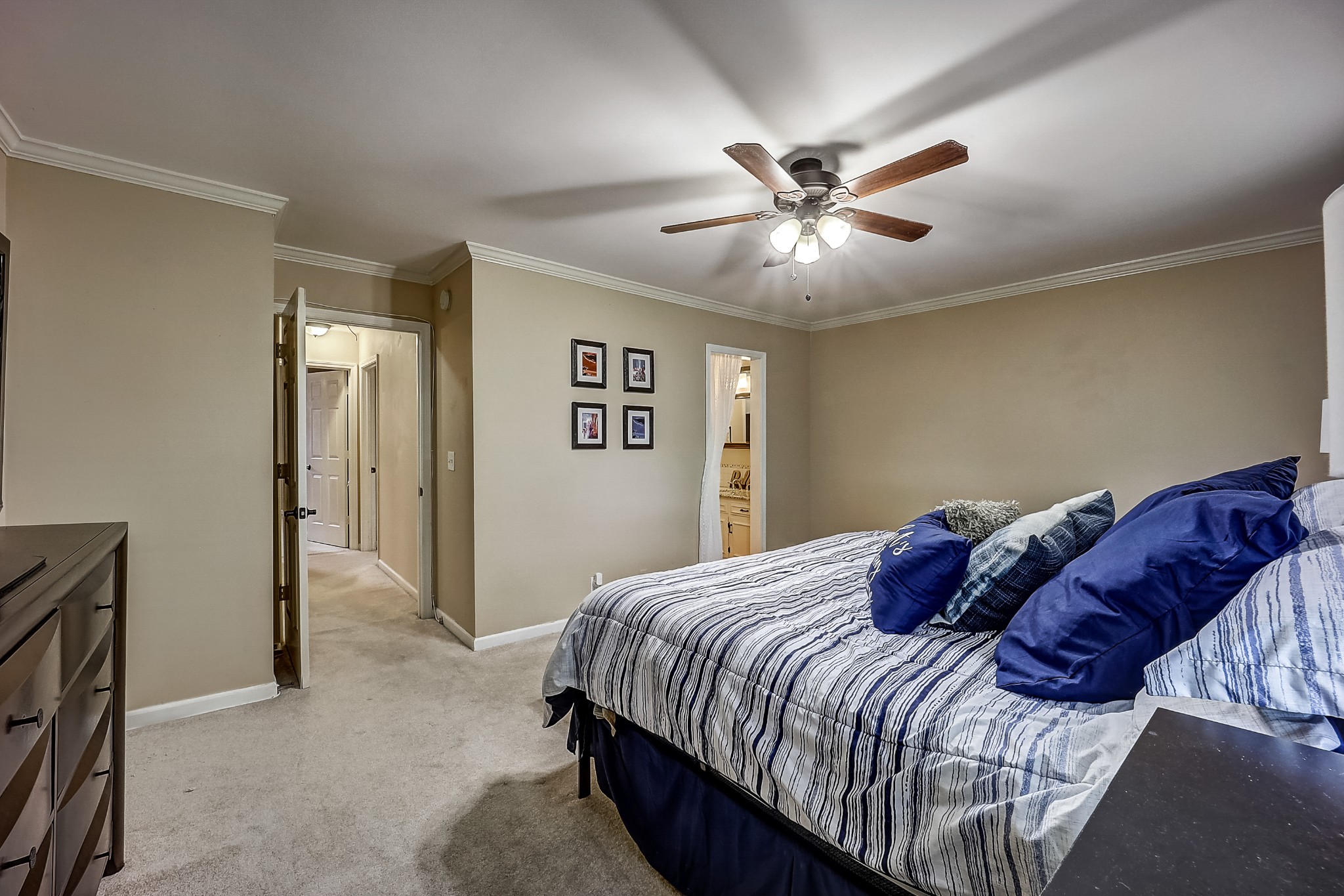 922 General George Patton Road Nashville, TN 37221 - Photo 18 of 30 a bedroom with a bed and a chandelier