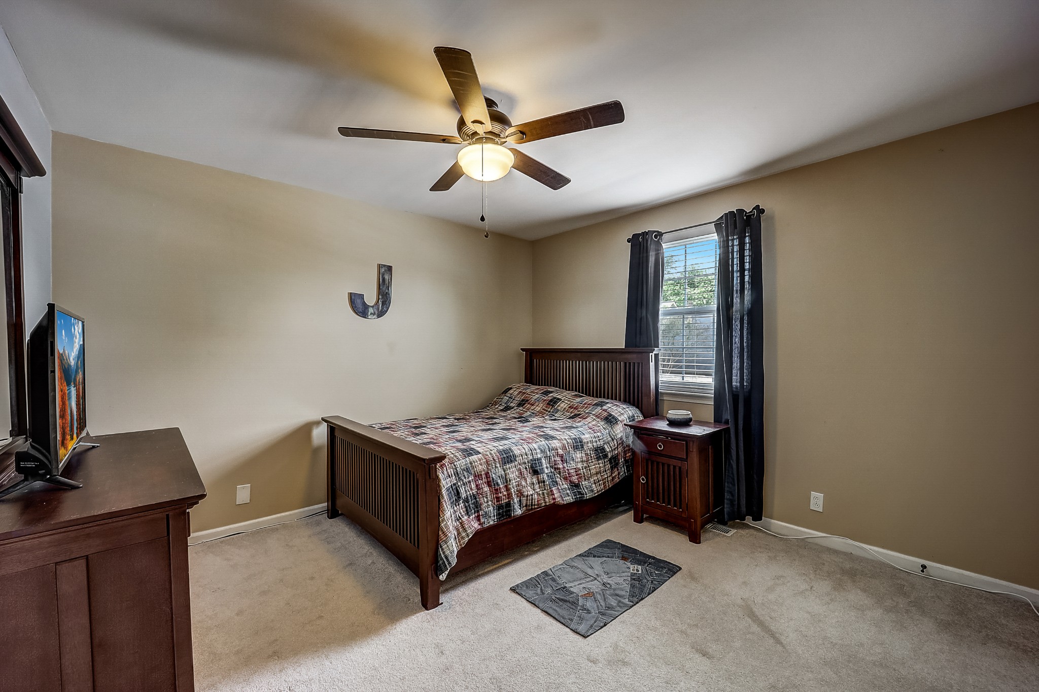 922 General George Patton Road Nashville, TN 37221 - Photo 20 of 30 a bedroom with a bed and a flat tv screen on the dresser