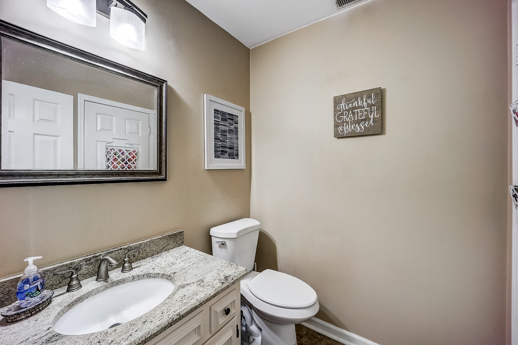 922 General George Patton Road Nashville, TN 37221 - Photo 21 of 30 a bathroom with a granite countertop toilet and a sink
