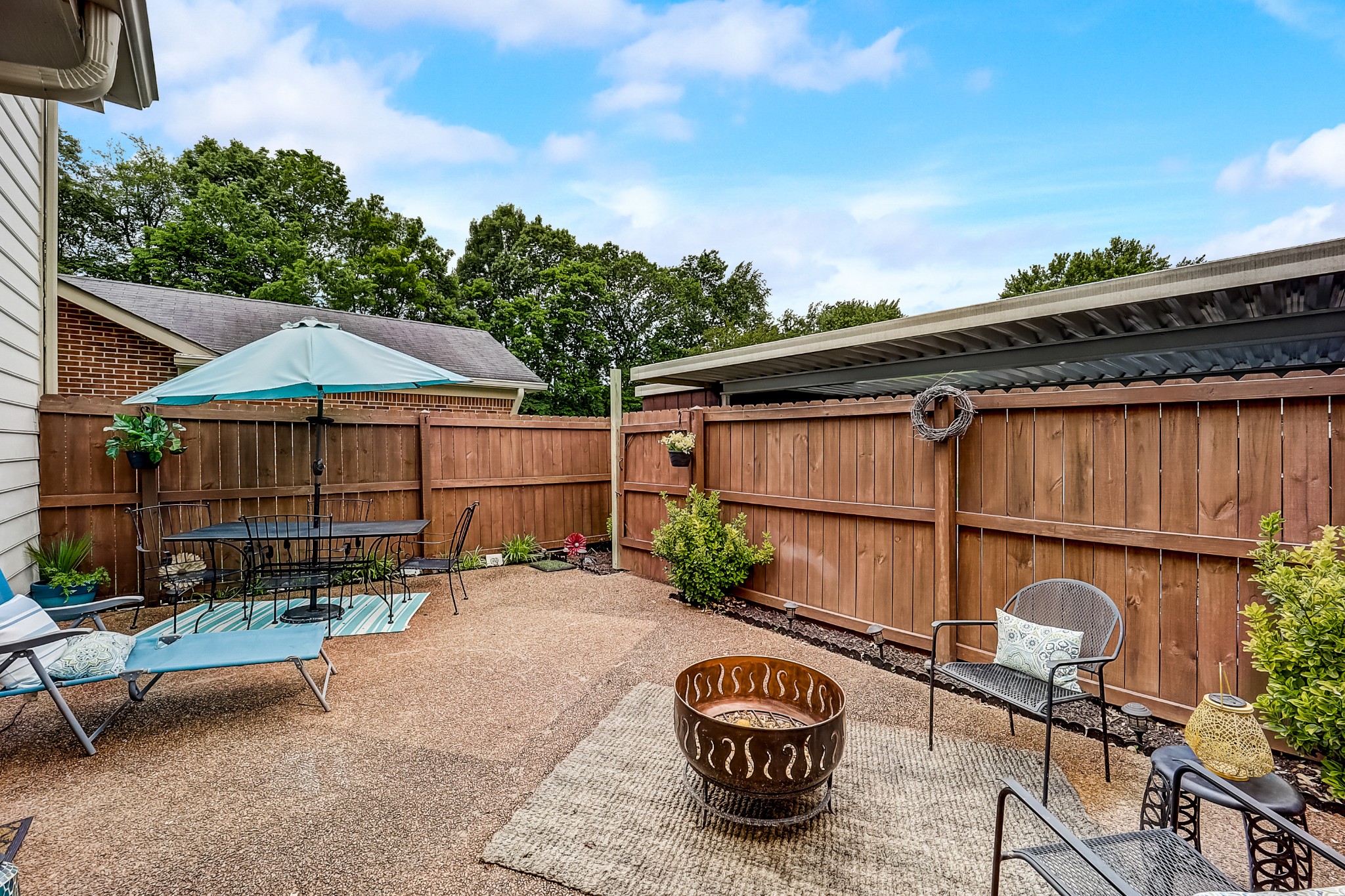 922 General George Patton Road Nashville, TN 37221 - Photo 23 of 30 a backyard of a house with barbeque oven table and chairs