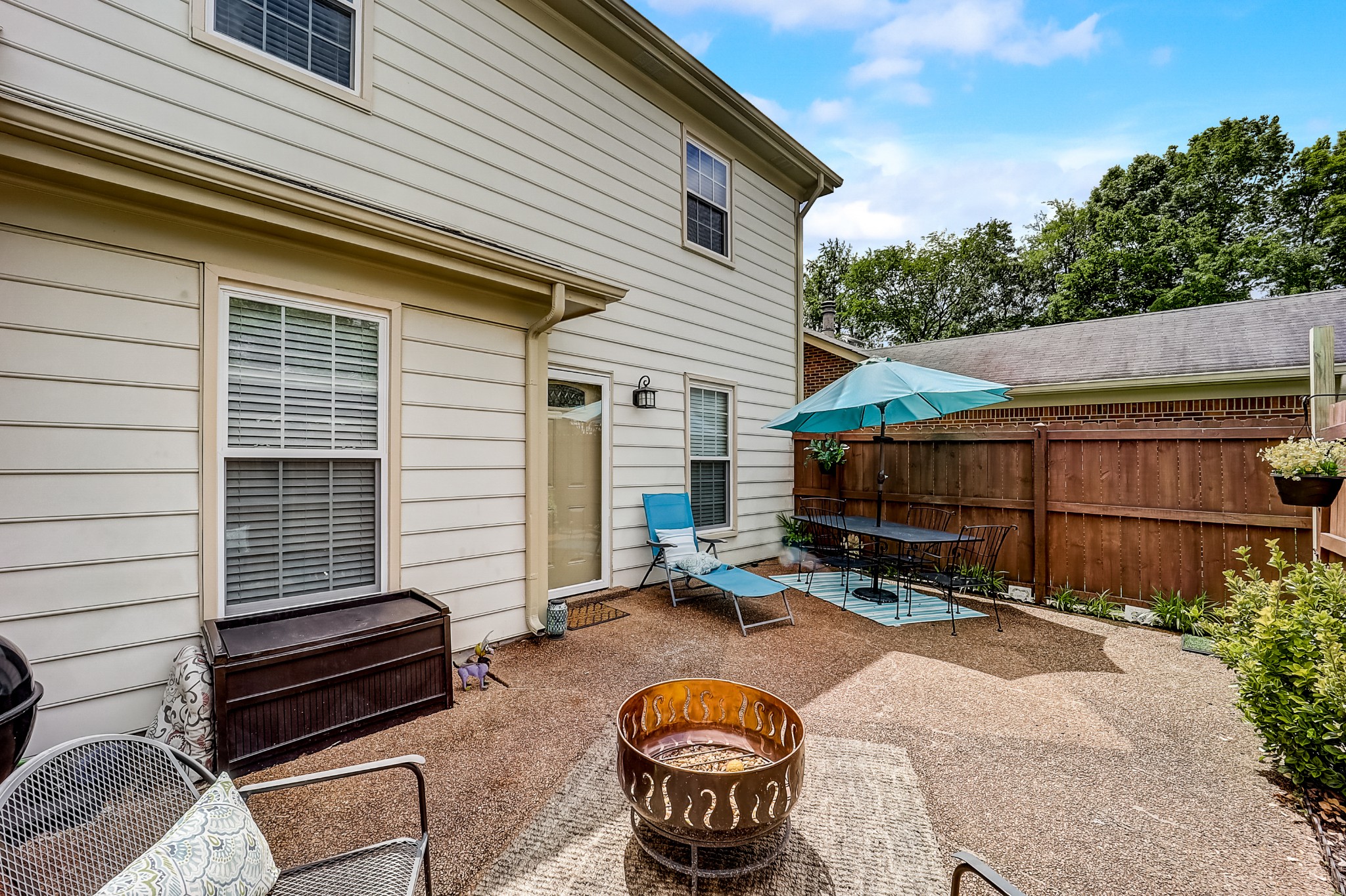 922 General George Patton Road Nashville, TN 37221 - Photo 24 of 30 a backyard of a house with barbeque oven table and chairs