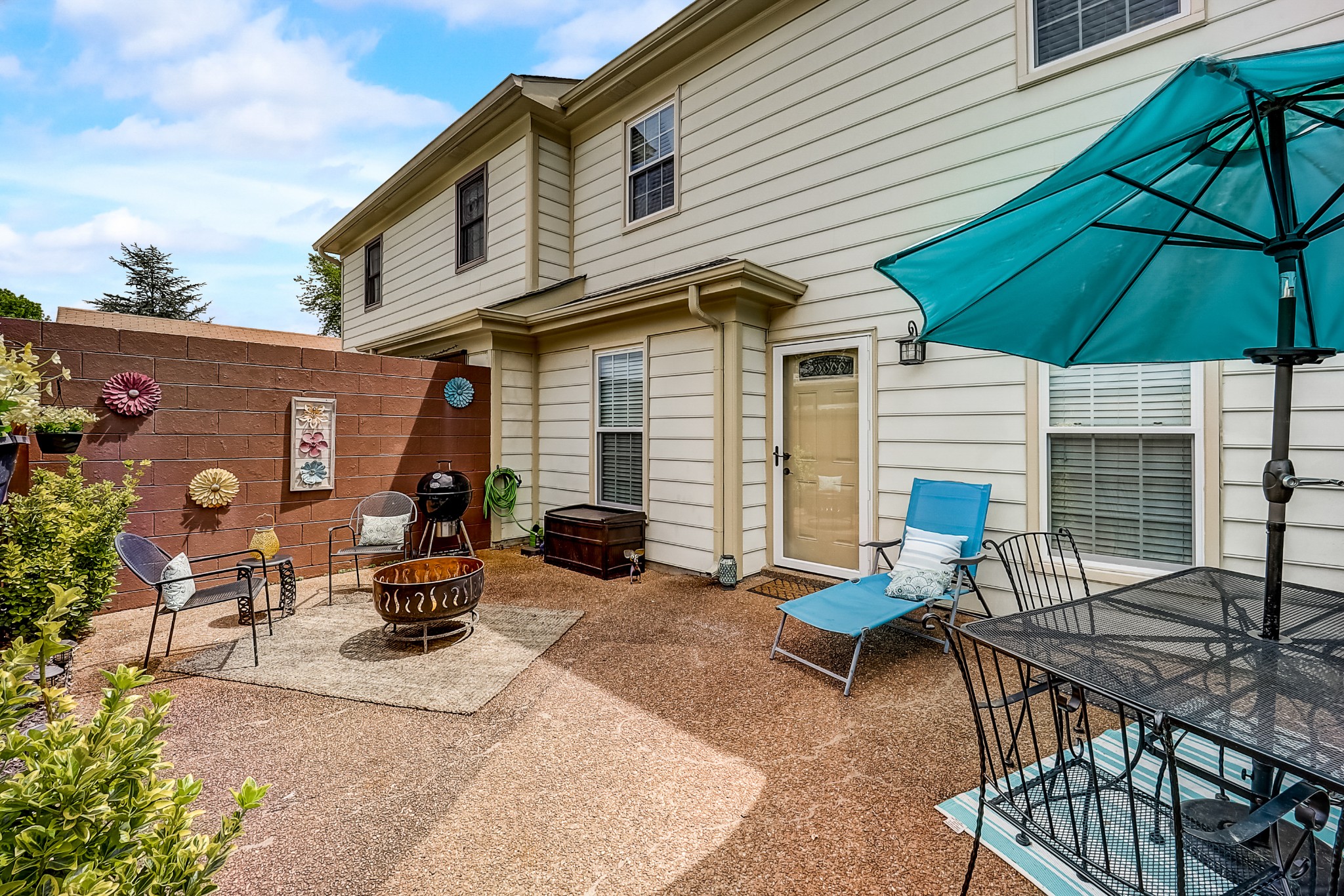 922 General George Patton Road Nashville, TN 37221 - Photo 25 of 30 a view of a patio with table and chairs under an umbrella