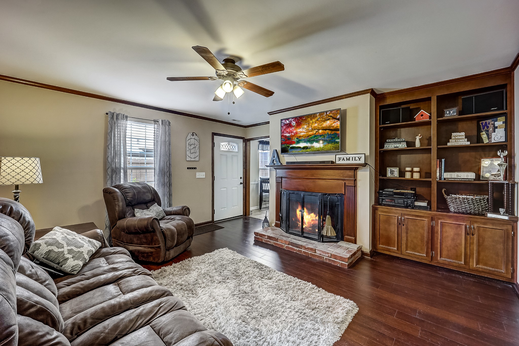 922 General George Patton Road Nashville, TN 37221 - Photo 4 of 30 a living room with furniture a flat screen tv and a fireplace