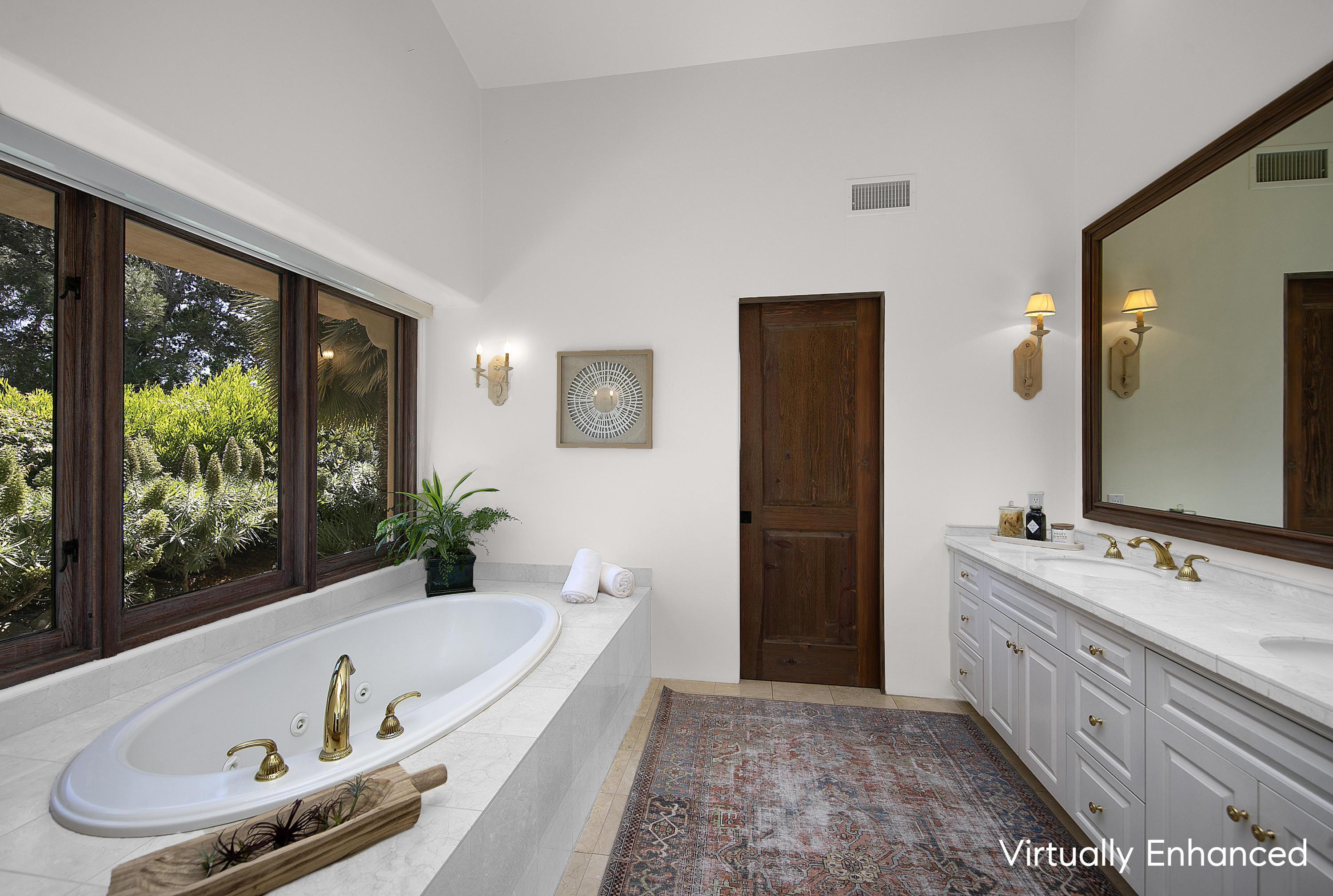2250 Ortega Ranch Road Summerland, CA 93067 - Photo 18 of 28 a bathroom with a tub a sink and a large mirror