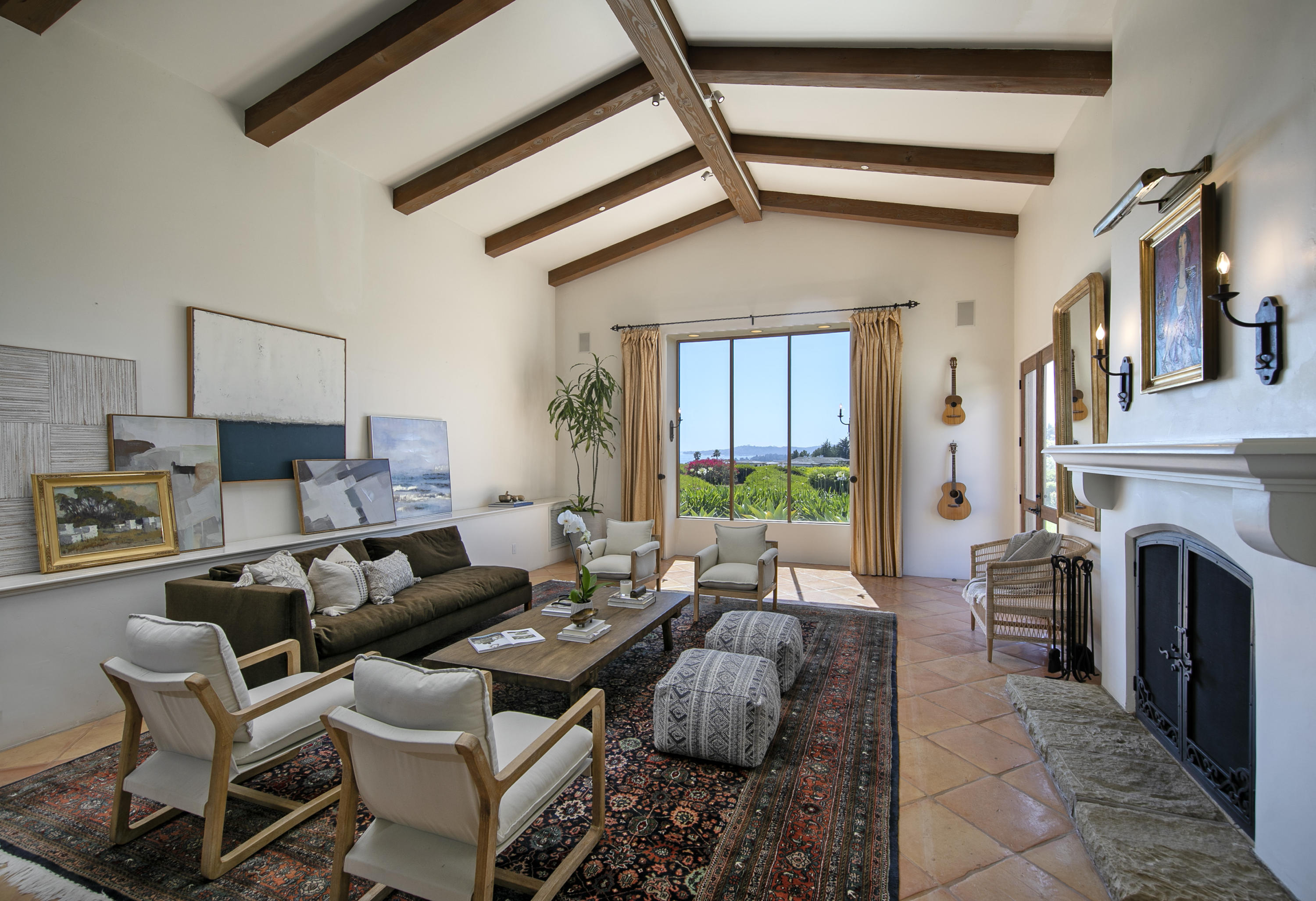 2250 Ortega Ranch Road Summerland, CA 93067 - Photo 9 of 28 a living room with furniture a fireplace and a table