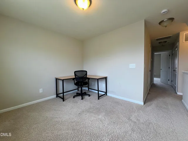 a view of a hallway with closet