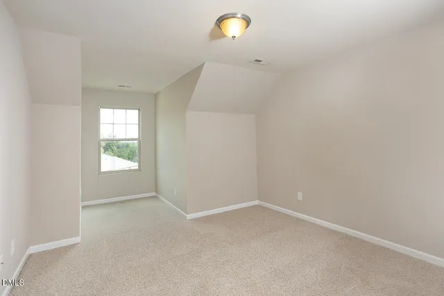 a bathroom with a sink a toilet a mirror and shower