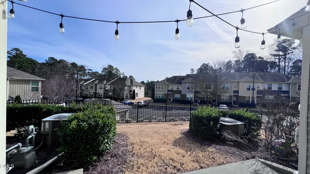 a view of house with outdoor space and sitting area