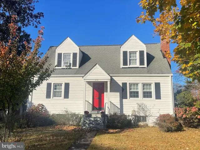 a front view of a house with yard