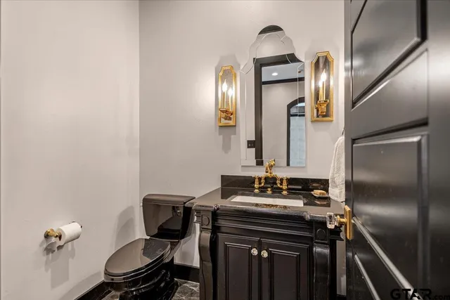 a bathroom with a sink a mirror and a shower