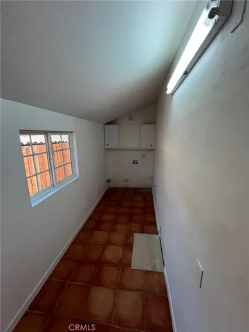 a view of a hallway with white walls