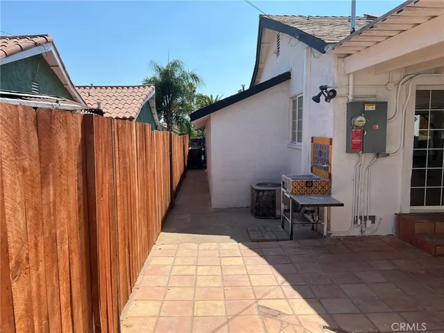 a view of a patio with table and chairs