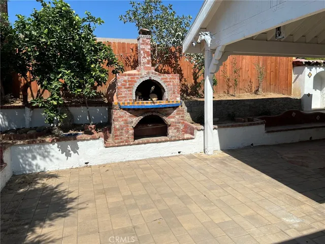 a view of outdoor space with garden and furniture