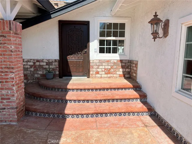 a front view of a house with a rug