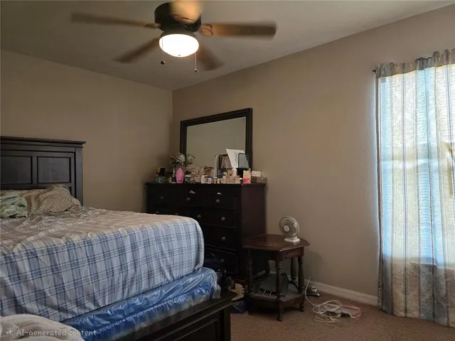 a bedroom with a bed and a table