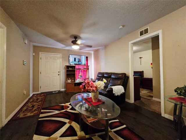 a room with furniture and wooden floor
