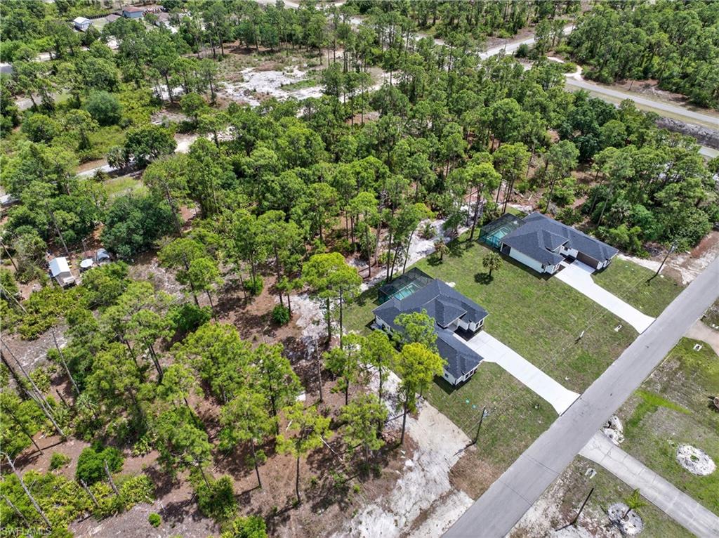 18 Scott Avenue Lehigh Acres, FL 33936 - Photo 8 of 37 an aerial view of residential houses with outdoor space