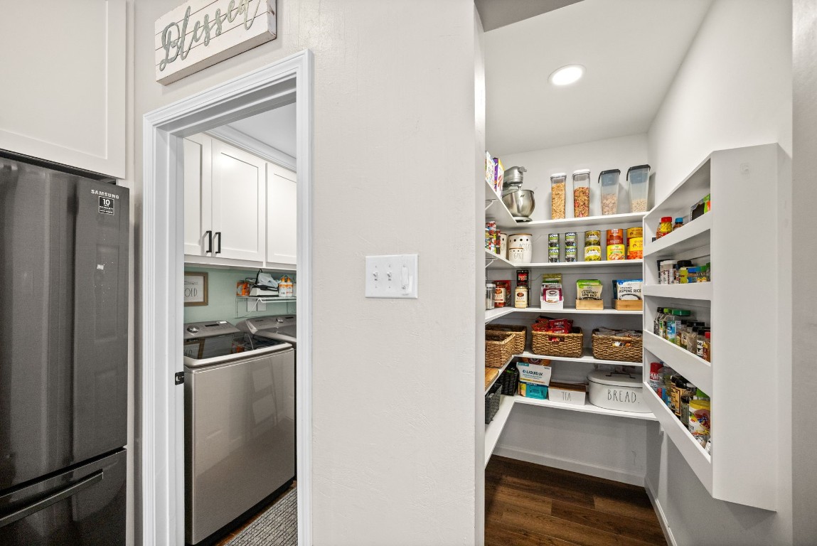 814 Legend Spring Drive Katy, TX 77494 - Photo 12 of 30 If a walk-in pantry is on your "must haves" list, here it is! The laundry room with built-in storage is conveniently located between the garage and the kitchen.