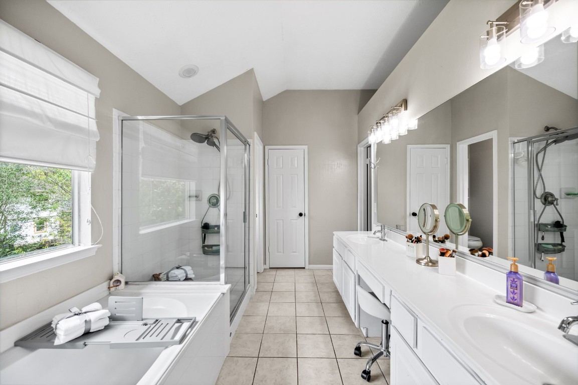 814 Legend Spring Drive Katy, TX 77494 - Photo 17 of 30 Soaker tub, walk-in shower, and dual sinks with a vanity space await you in your primary bath. A private water closet separates the toilet from the main bath area.