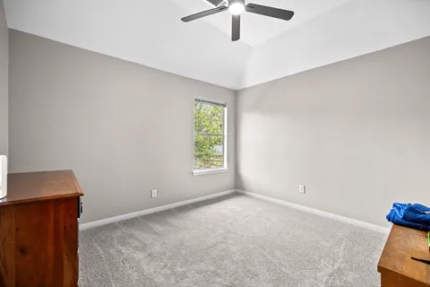 a very nice looking room with a large window and chandelier