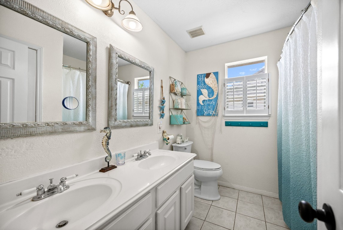 814 Legend Spring Drive Katy, TX 77494 - Photo 22 of 30 Full bath #2 is upstairs and is equipped with dual sinks, upgraded mirrors and a tub/shower combo.