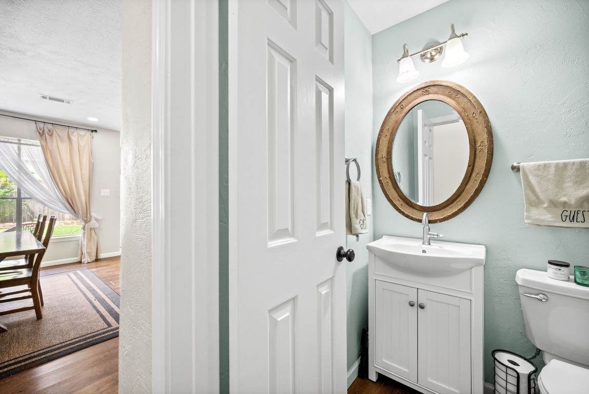 814 Legend Spring Drive Katy, TX 77494 - Photo 23 of 30 Downstairs is a serene powder room for guest use with upgraded sink, mirror, and lighting.