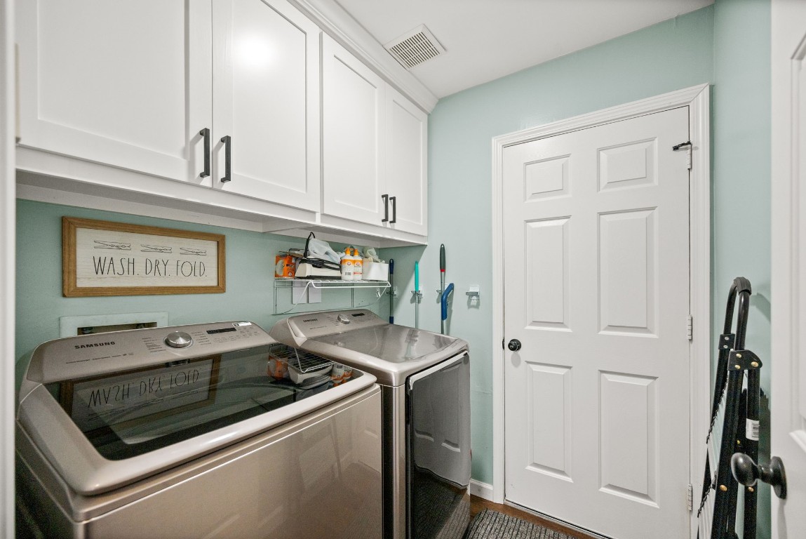814 Legend Spring Drive Katy, TX 77494 - Photo 24 of 30 The laundry room has built-in storage and direct access to the garage and the kitchen. Even this utilitarian space got the designer touch with a soothing color scheme and the same flooring found throughout the first floor.