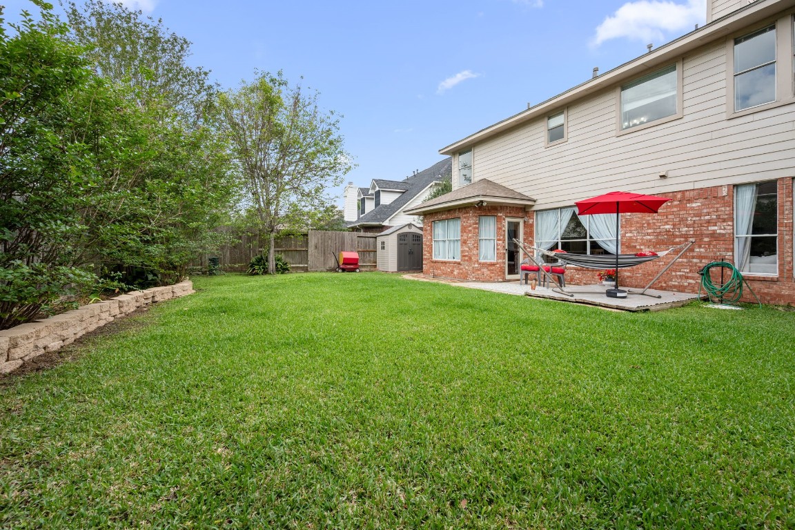 814 Legend Spring Drive Katy, TX 77494 - Photo 26 of 30 The backyard has space for pets, playscapes, and all of your future plans.