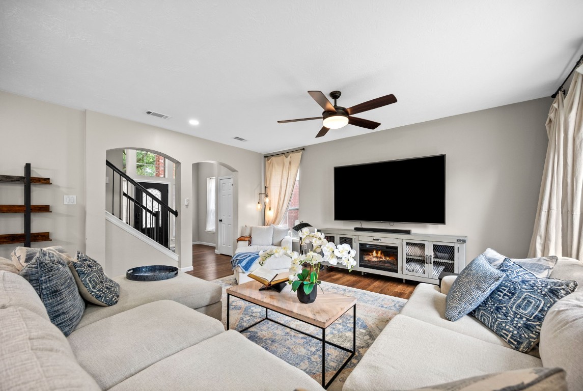 814 Legend Spring Drive Katy, TX 77494 - Photo 6 of 30 The entry foyer is impressive, but this living room is a showstopper! With room for even the largest sectional, this space is ready for large scale entertaining or quiet movie nights. Bathed in natural light, this space is large and open while still managing to feel welcoming and cozy.