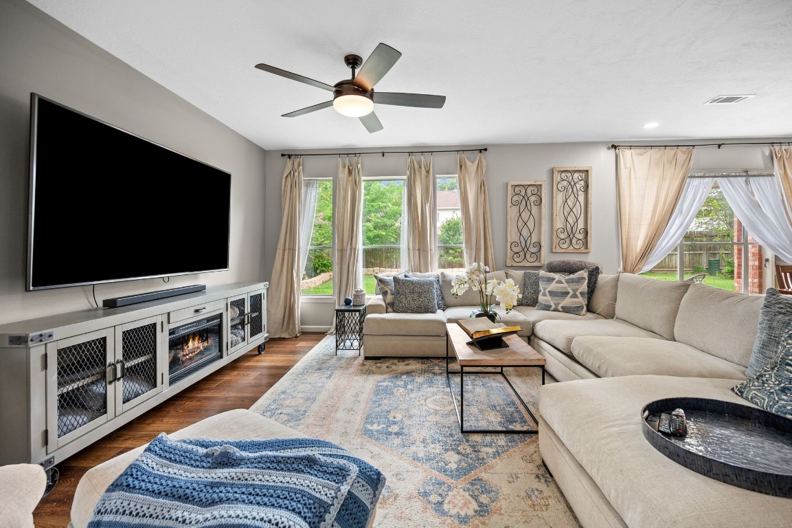 814 Legend Spring Drive Katy, TX 77494 - Photo 7 of 30 Views from the living room to the back patio/backyard. Updated lighting, curtains, and a neutral color scheme allow you to focus on your decor selections--no having to "make it work" here!