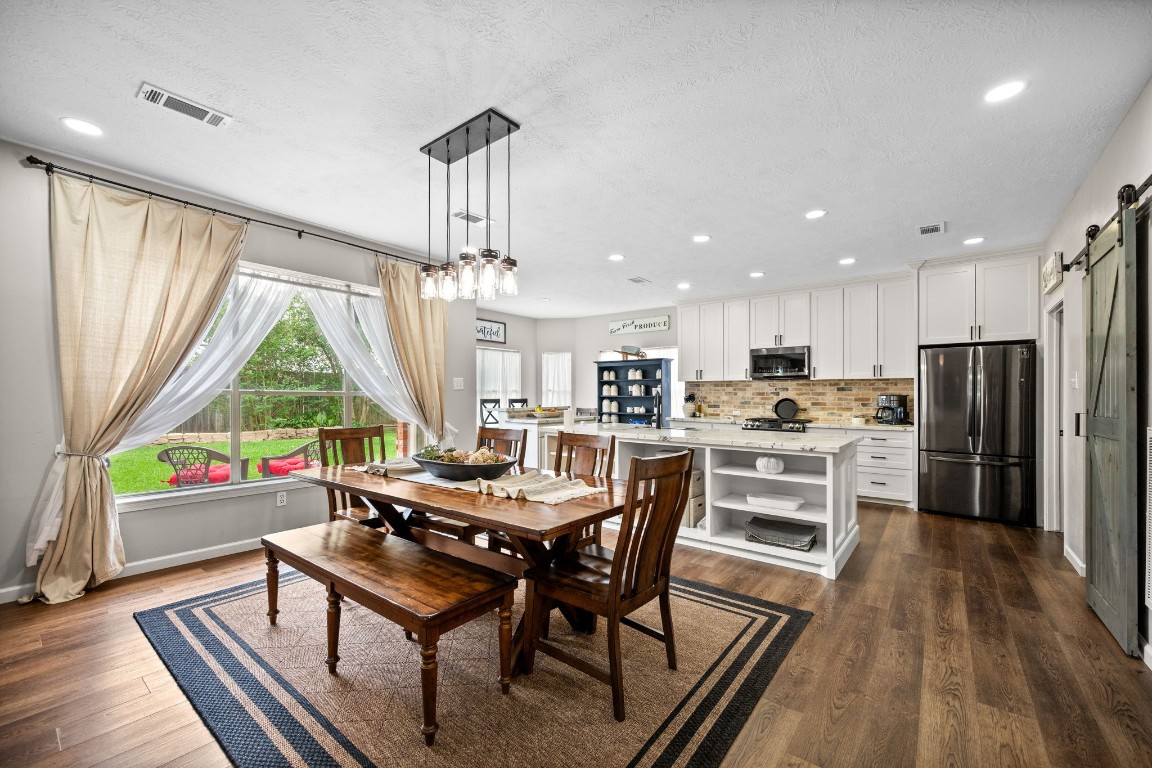 814 Legend Spring Drive Katy, TX 77494 - Photo 30 of 30 The open floorplan means you never have to miss a moment of the fun when entertaining. Enjoy being part of the conversation even if you are doing the dishes. From this vantage point, you have views of all of the downstairs entertaining spaces, both inside and out.