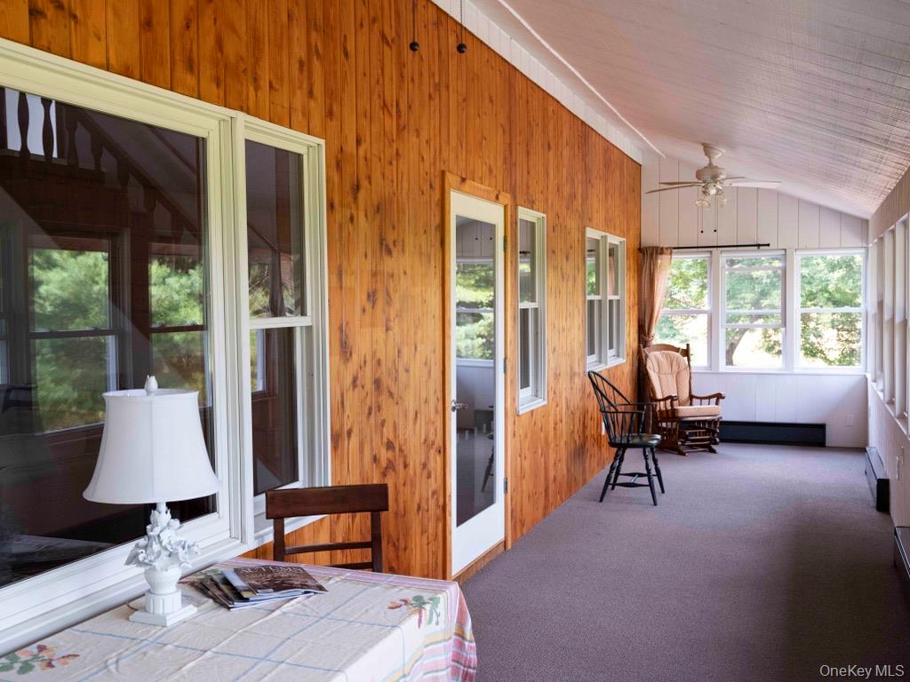 284 Ridge Road Hamden, NY 13782 - Photo 10 of 44 Just off the living room is this special sunporch. A place for peace and relaxation