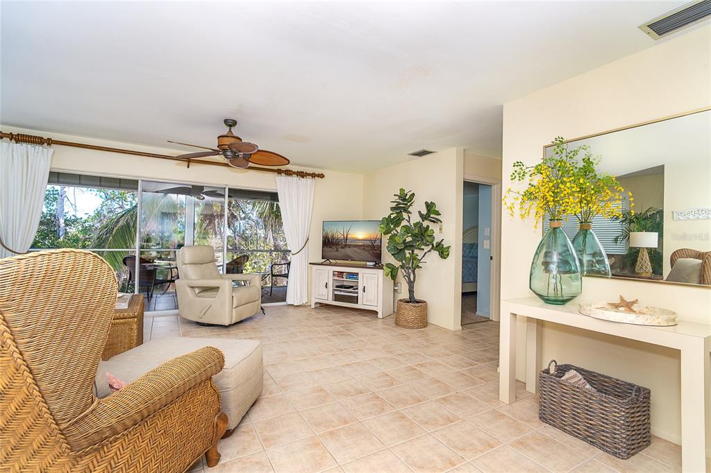 290 South Gulf Boulevard, Unit 31 Placida, FL 33946 - Photo 15 of 63 a very nice looking living room with a large window and a fireplace